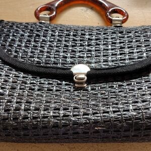 Elegant Black and Silver Woven Clutch with Brown Accents